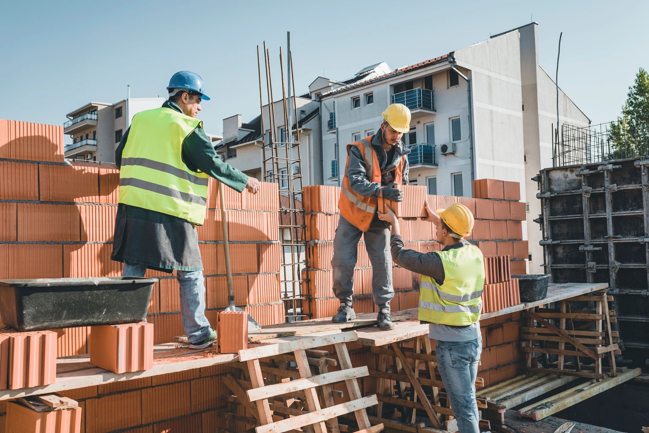 Construction workers performing concrete work