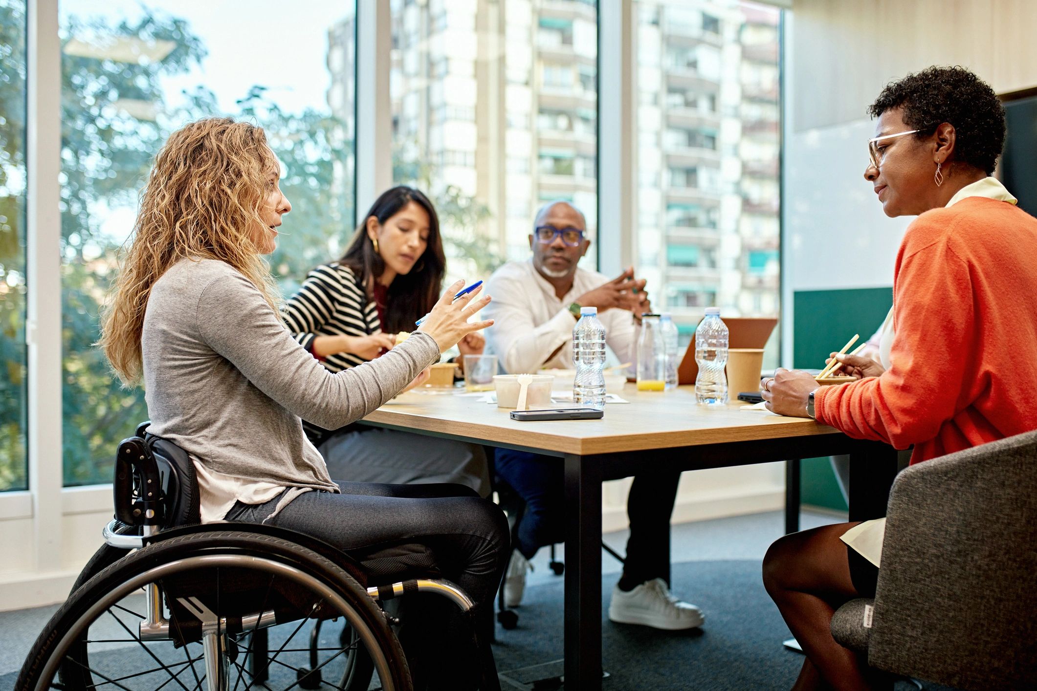 Professionals collaborating in a boardroom meeting