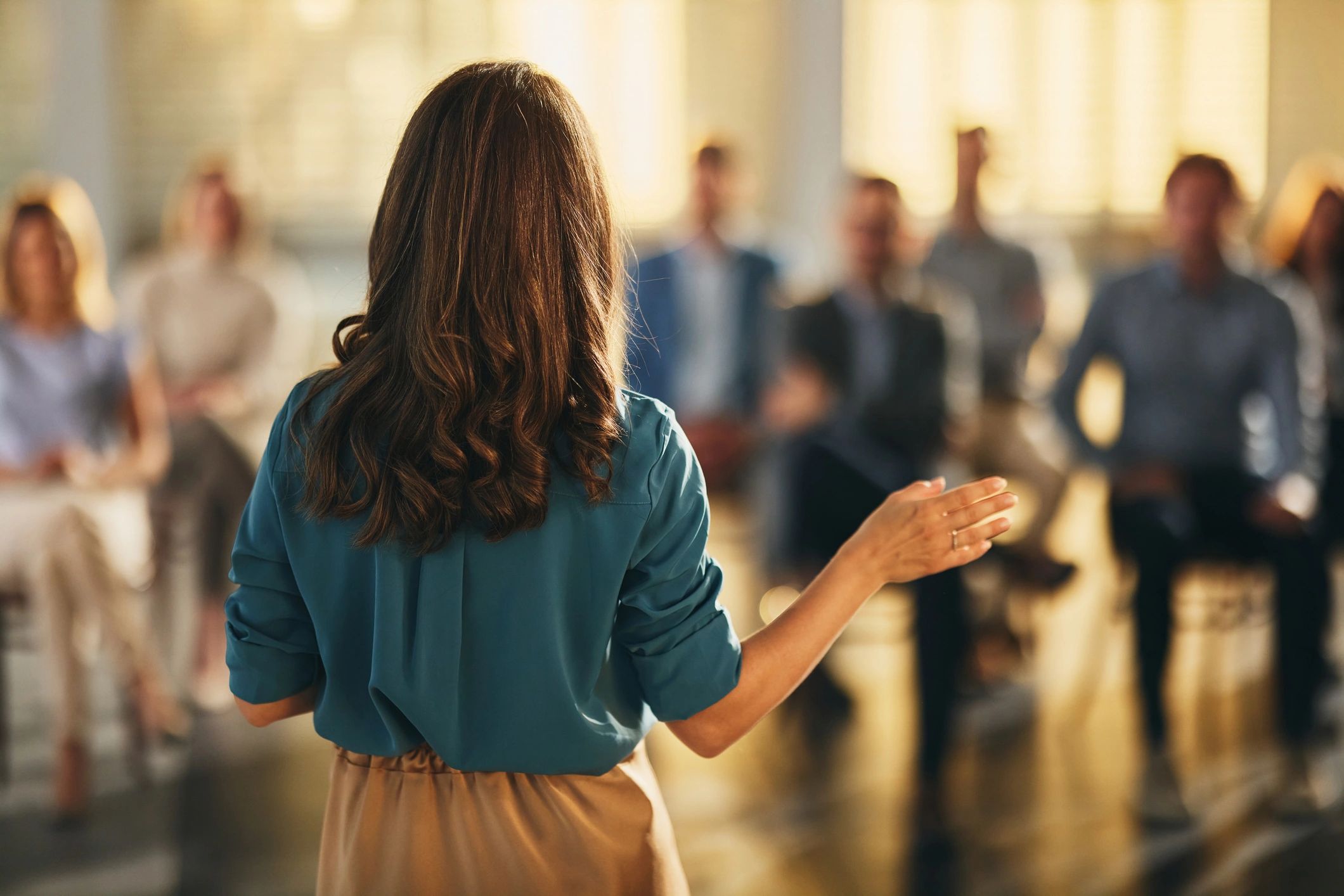 Business leader speaking to a team in a boardroom