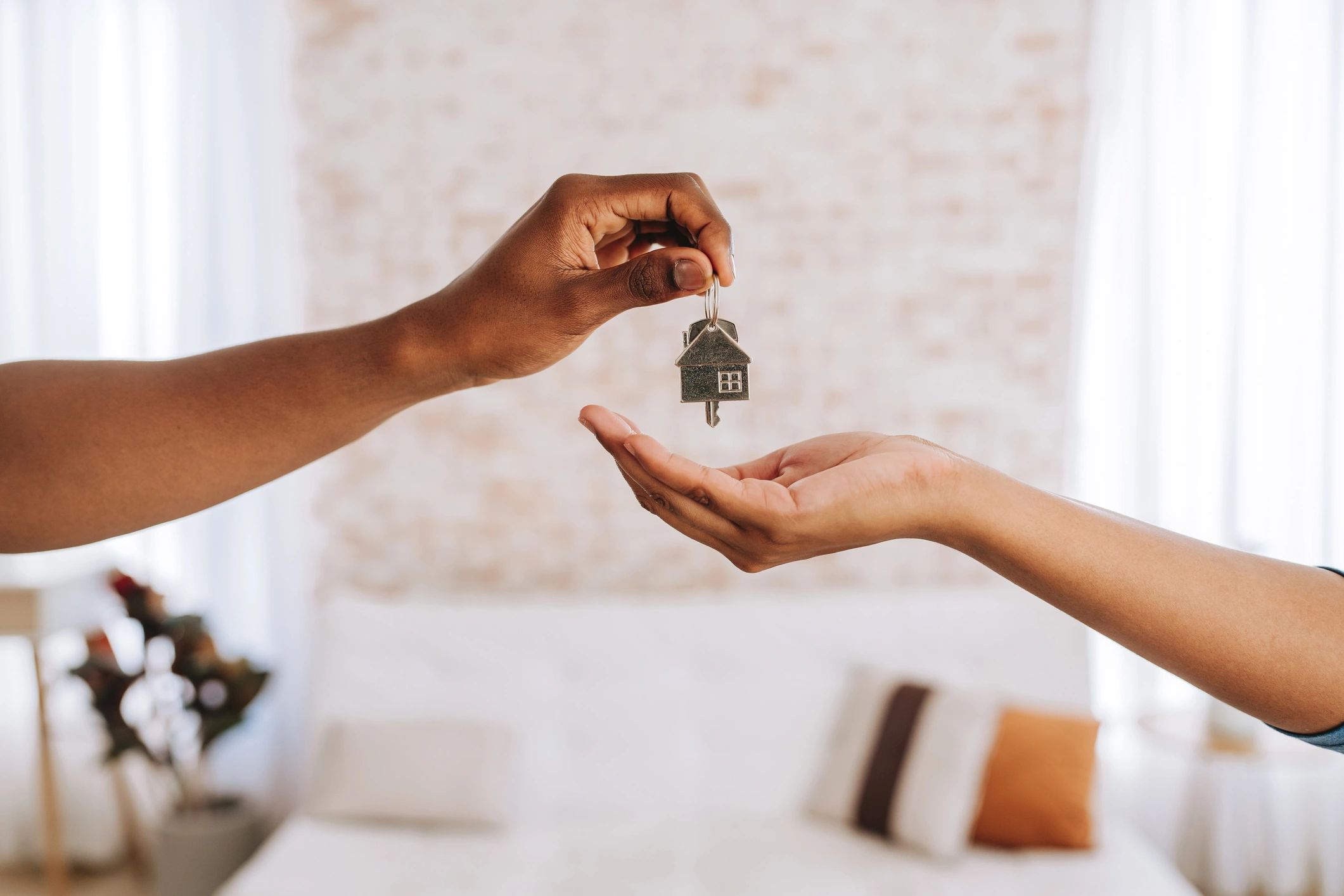 Real estate agent handing over keys during a property transaction