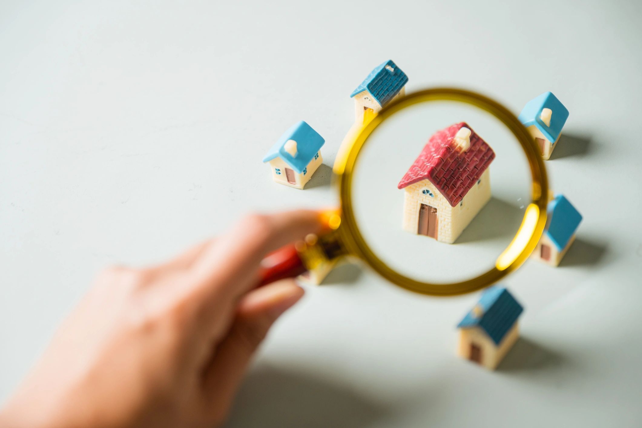 Real estate investment analysis with documents and magnifying glass