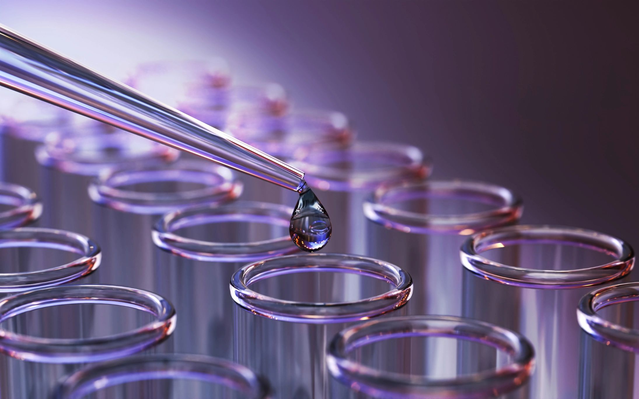Laboratory glassware and pipette dispensing liquid into test tubes